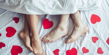Cropped,Image,Of,Young,Couple,Is,Lying,On,Bed.,Close